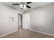 Bedroom with tile flooring and access to hallway at 7004 N 11Th Way, Phoenix, AZ 85020