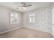 bedroom with airplane-themed wallpaper and tile flooring at 7004 N 11Th Way, Phoenix, AZ 85020