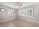 Spacious bedroom with tile flooring and large windows with shutters at 7004 N 11Th Way, Phoenix, AZ 85020