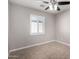 Well-lit bedroom with ceiling fan and tile flooring at 7004 N 11Th Way, Phoenix, AZ 85020