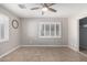 Simple bedroom with tile flooring and ceiling fan at 7004 N 11Th Way, Phoenix, AZ 85020