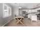 Kitchen adjacent dining area with wood table and chairs at 7004 N 11Th Way, Phoenix, AZ 85020