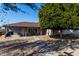 House exterior with covered patio and mature tree at 7004 N 11Th Way, Phoenix, AZ 85020