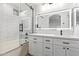 Modern bathroom with white cabinets, a soaking tub, and a walk-in shower at 7235 E Norwood St, Mesa, AZ 85207