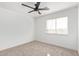 Well-lit bedroom featuring neutral walls and carpet at 7235 E Norwood St, Mesa, AZ 85207