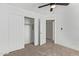 Spacious bedroom with mirrored closet doors and neutral walls at 7235 E Norwood St, Mesa, AZ 85207