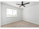 Spacious bedroom with neutral walls and carpet, and a window with blinds at 7235 E Norwood St, Mesa, AZ 85207