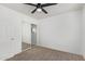 Bright bedroom with mirrored closet and ceiling fan at 7235 E Norwood St, Mesa, AZ 85207