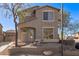 Two-story house with neutral exterior, landscaping, and a two-car garage at 7235 E Norwood St, Mesa, AZ 85207