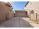 Two-car garage with gated entry and basketball hoop at 7235 E Norwood St, Mesa, AZ 85207