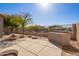 Private backyard patio with built-in grill and fire pit at 7235 E Norwood St, Mesa, AZ 85207