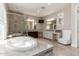 Elegant bathroom featuring a large soaking tub, glass shower, and dual vanities at 7456 S Brighton --, Queen Creek, AZ 85142