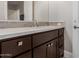 Bathroom vanity featuring dark wood cabinetry, drawers, and a white countertop at 7456 S Brighton --, Queen Creek, AZ 85142