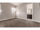 Neutral bedroom featuring plush carpeting, a window, and bathroom access at 7456 S Brighton --, Queen Creek, AZ 85142