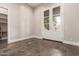 Bedroom featuring tile flooring, french doors and walk in closet access at 7456 S Brighton --, Queen Creek, AZ 85142