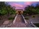 Inviting home entrance with well-lit brick stairs and professional landscaping at 7456 S Brighton --, Queen Creek, AZ 85142