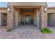 Covered front entrance with stone pillars, lighting, and a double-door entry at 7456 S Brighton --, Queen Creek, AZ 85142