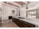 Large kitchen island with gas cooktop and view of the living room at 7456 S Brighton --, Queen Creek, AZ 85142