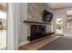 Close up of a stone fireplace with a flatscreen television above it at 7456 S Brighton --, Queen Creek, AZ 85142