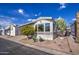 Single wide manufactured home with a covered carport at 7750 E Broadway Rd # 684, Mesa, AZ 85208