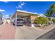 Manufactured home with covered parking and desert landscaping at 7750 E Broadway Rd # 684, Mesa, AZ 85208