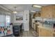 Cozy kitchen featuring wood cabinets and a dining area at 7750 E Broadway Rd # 684, Mesa, AZ 85208