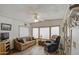 Bright sunroom featuring a couch, recliner, and large windows at 7750 E Broadway Rd # 684, Mesa, AZ 85208