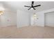 Large bedroom features neutral carpet, ceiling fan, white walls and closet at 8531 E Laredo Ln, Scottsdale, AZ 85250