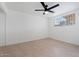 Bright bedroom with neutral carpet and a ceiling fan at 8531 E Laredo Ln, Scottsdale, AZ 85250