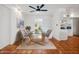 Dining room boasts tile flooring, modern light fixture, and seating for six near the kitchen at 8531 E Laredo Ln, Scottsdale, AZ 85250