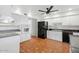 Well-lit kitchen features white cabinetry, tile flooring, and modern appliances at 8531 E Laredo Ln, Scottsdale, AZ 85250