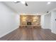 Spacious living room featuring a stone fireplace and wood flooring at 8531 E Laredo Ln, Scottsdale, AZ 85250