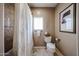 Bathroom featuring a shower, a toilet, and decorative accents at 9015 E Hackamore Dr, Scottsdale, AZ 85255