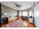 Relaxing bedroom/office space with hardwood flooring and a ceiling fan at 9015 E Hackamore Dr, Scottsdale, AZ 85255