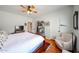 Bedroom featuring hardwood floors, ceiling fan, and neutral paint tones at 9015 E Hackamore Dr, Scottsdale, AZ 85255