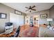 Bedroom with hardwood floors, a ceiling fan, and access to the Primary bathroom at 9015 E Hackamore Dr, Scottsdale, AZ 85255