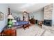 Bright bedroom with a four-poster bed, fireplace, tile flooring, and neutral wall color at 9015 E Hackamore Dr, Scottsdale, AZ 85255