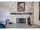 Close-up of a stacked stone fireplace, featuring a rustic mantel and elegant decor accents at 9015 E Hackamore Dr, Scottsdale, AZ 85255