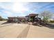 Front elevation of the home showing the walkway, beautiful landscaping, and desert foliage at 9015 E Hackamore Dr, Scottsdale, AZ 85255