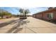 Driveway with a three-car garage and beautiful desert landscaping at 9015 E Hackamore Dr, Scottsdale, AZ 85255