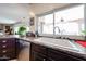 Bright kitchen sink area with view of the backyard through a window at 9015 E Hackamore Dr, Scottsdale, AZ 85255