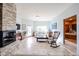 Bright living area featuring tile floors, fireplace, with a traditional seating arrangement at 9015 E Hackamore Dr, Scottsdale, AZ 85255