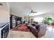 Cozy living room featuring a brick fireplace and entertainment center at 9015 E Hackamore Dr, Scottsdale, AZ 85255