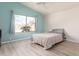 Bright bedroom with large window and light-colored flooring at 9016 W Harmony Ln, Peoria, AZ 85382