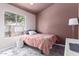 Cozy bedroom with a window and contemporary decor at 9016 W Harmony Ln, Peoria, AZ 85382