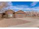 One-story house with two-car garage, desert landscaping, and light brown exterior at 9016 W Harmony Ln, Peoria, AZ 85382