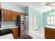 Modern kitchen with stainless steel appliances and wood cabinets at 9016 W Harmony Ln, Peoria, AZ 85382