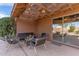 Relaxing patio with seating area and pergola at 9016 W Harmony Ln, Peoria, AZ 85382