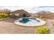 Kidney-shaped pool surrounded by a gravel patio and desert landscaping at 9016 W Harmony Ln, Peoria, AZ 85382