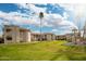 Aerial view of a condo community with lush green lawns and palm trees at 9151 W Greenway Rd # 276, Peoria, AZ 85381